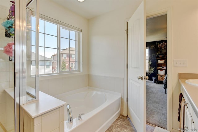 4863 Wildflower Pl, Dacono, CO 80514 - full bath with a garden tub, vanity, and a stall shower