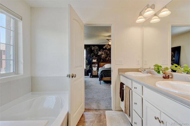 4863 Wildflower Pl, Dacono, CO 80514 - bathroom with ensuite bath, double vanity, and a garden tub