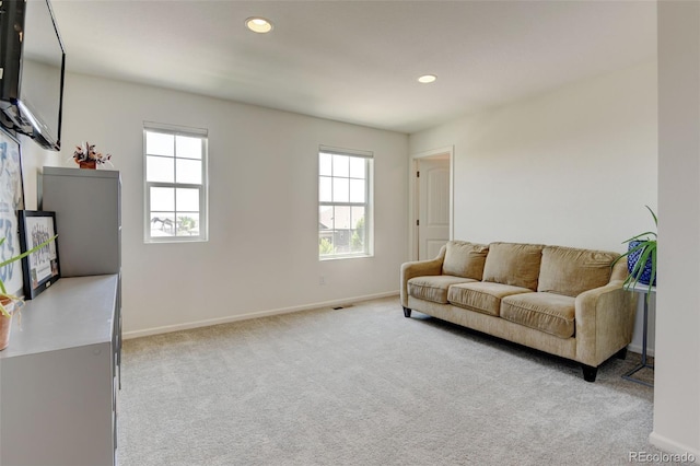 4863 Wildflower Pl, Dacono, CO 80514 - carpeted living area with plenty of natural light and recessed lighting