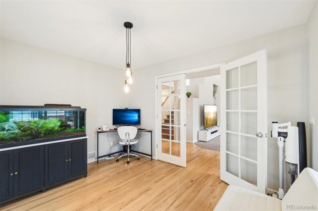 office space featuring french doors and light wood-style flooring