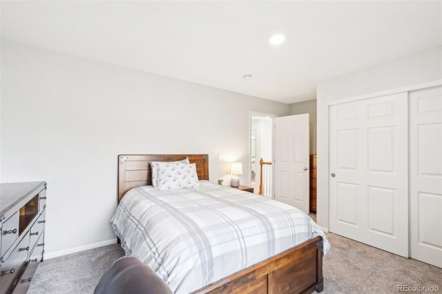 carpeted bedroom featuring a closet, baseboards, and recessed lighting