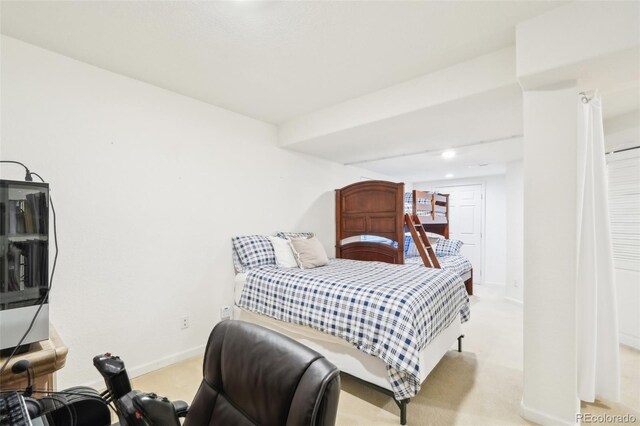 carpeted bedroom featuring baseboards and recessed lighting