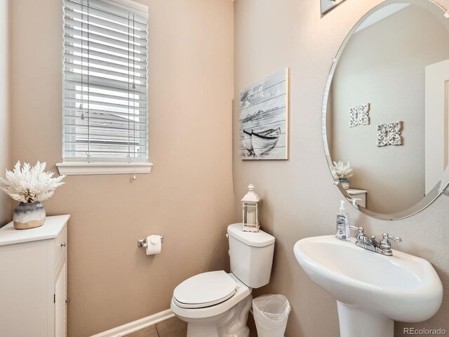 8522 S Dudley St, Littleton, CO 80128 - bathroom with toilet and tile patterned floors