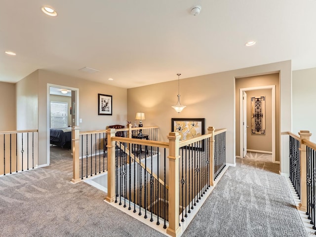 8522 S Dudley St, Littleton, CO 80128 - hall with an upstairs landing, carpet flooring, and recessed lighting