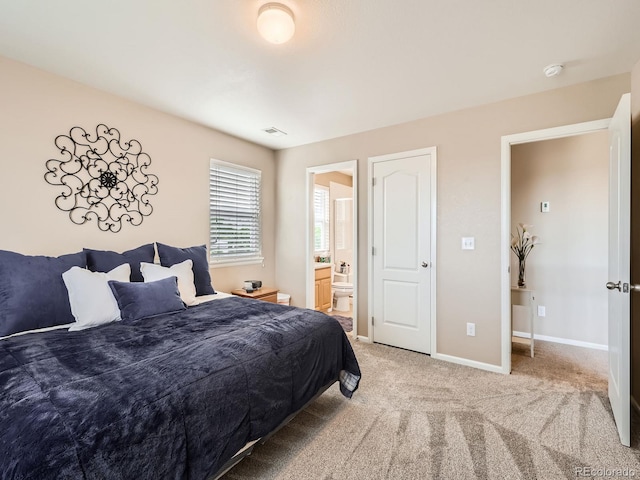 8522 S Dudley St, Littleton, CO 80128 - bedroom with light carpet and connected bathroom