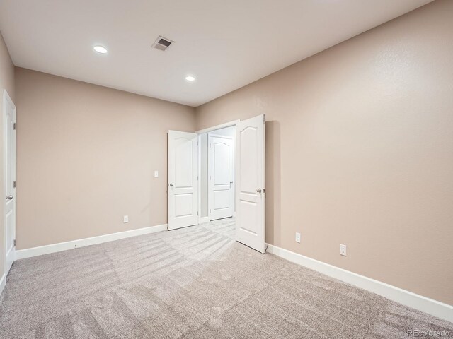 8522 S Dudley St, Littleton, CO 80128 - unfurnished bedroom with light colored carpet and recessed lighting