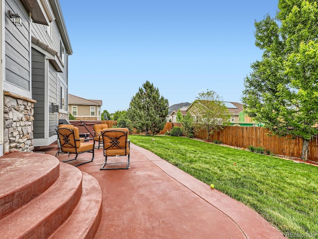 8522 S Dudley St, Littleton, CO 80128 - fenced backyard featuring a patio and outdoor lounge area