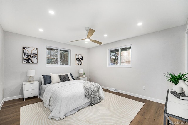 bedroom with visible vents, baseboards, ceiling fan, dark wood-type flooring, and recessed lighting