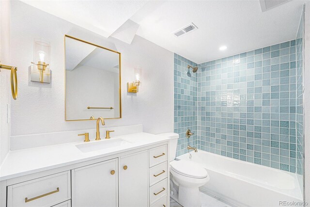 bathroom with toilet, tub / shower combination, vanity, and visible vents