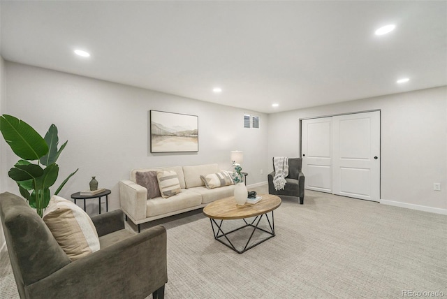 living room featuring baseboards, recessed lighting, visible vents, and light colored carpet