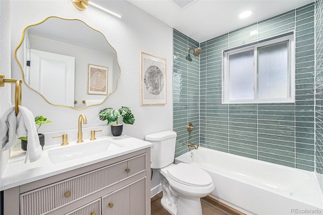 full bath featuring shower / tub combination, vanity, toilet, and wood finished floors