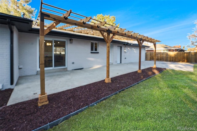 rear view of property with brick siding, fence, a patio, and a pergola