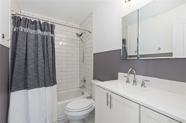 full bathroom featuring shower / bath combo with shower curtain, vanity, and toilet