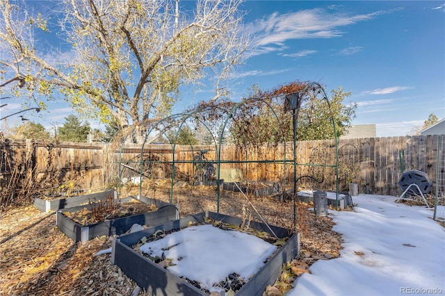 view of yard layered in snow