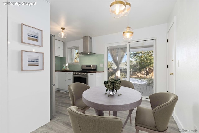 dining area with light hardwood / wood-style floors