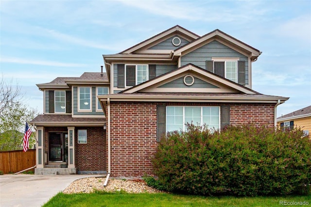 4873 S Fultondale Way, Aurora, CO 80016 - traditional home featuring fence and brick siding