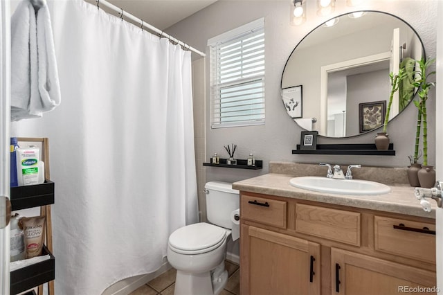 4873 S Fultondale Way, Aurora, CO 80016 - full bathroom featuring toilet, vanity, tile patterned flooring, and a shower with shower curtain
