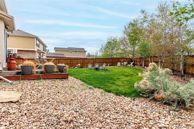 4873 S Fultondale Way, Aurora, CO 80016 - view of yard with a fire pit and a wooden deck