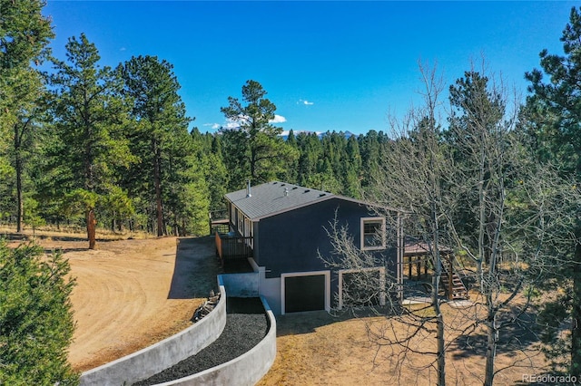 view of side of property with a garage