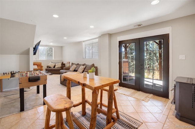 rec room with french doors and light tile patterned flooring