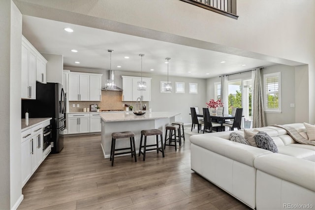 living room with sink and hardwood / wood-style flooring