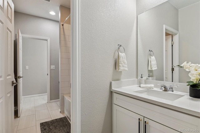 bathroom with tile flooring, vanity, and shower / bathing tub combination