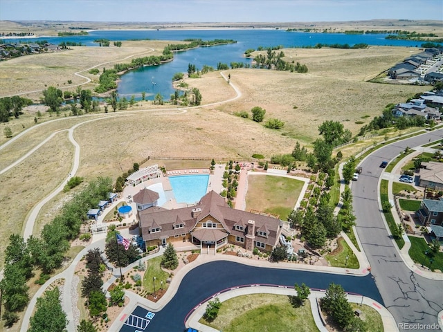 birds eye view of property with a water view