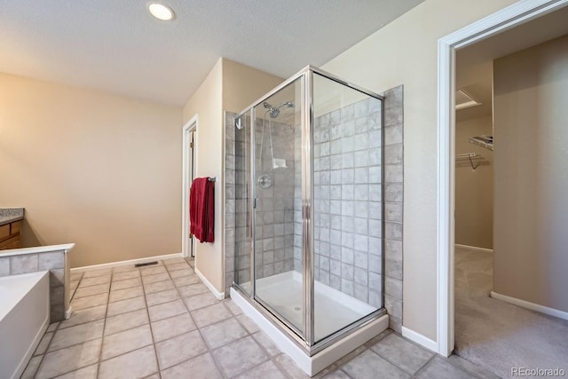 bathroom with tile patterned flooring and an enclosed shower