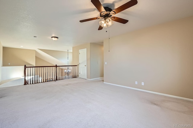 empty room featuring carpet flooring and ceiling fan