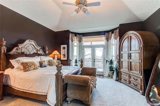 carpeted bedroom featuring access to exterior, french doors, vaulted ceiling, and ceiling fan