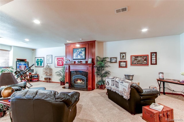 living room featuring a fireplace and light colored carpet