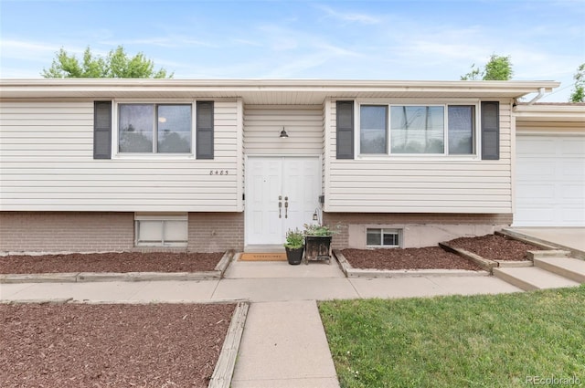8485 W 44th Ave, Wheat Ridge, CO 80033 - view of front of property featuring a garage
