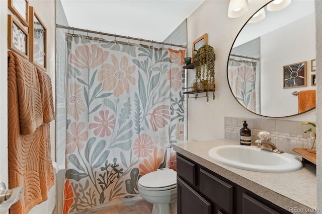 8485 W 44th Ave, Wheat Ridge, CO 80033 - bathroom with vanity, tasteful backsplash, and tile patterned flooring