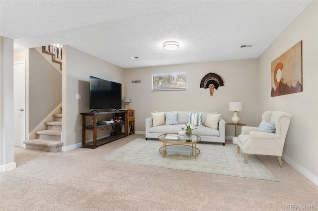 8485 W 44th Ave, Wheat Ridge, CO 80033 - living area featuring stairs, carpet, and a textured ceiling