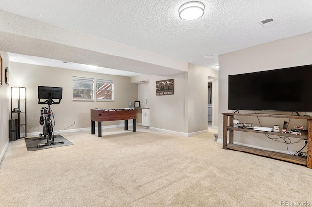 8485 W 44th Ave, Wheat Ridge, CO 80033 - rec room with light colored carpet and a textured ceiling