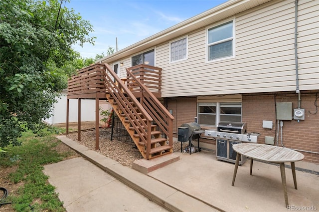 8485 W 44th Ave, Wheat Ridge, CO 80033 - view of patio with a grill, a wooden deck, and stairway