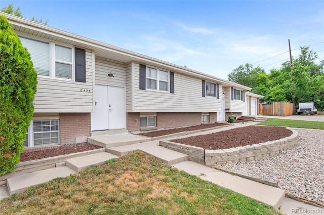 8485 W 44th Ave, Wheat Ridge, CO 80033 - bi-level home featuring a garage