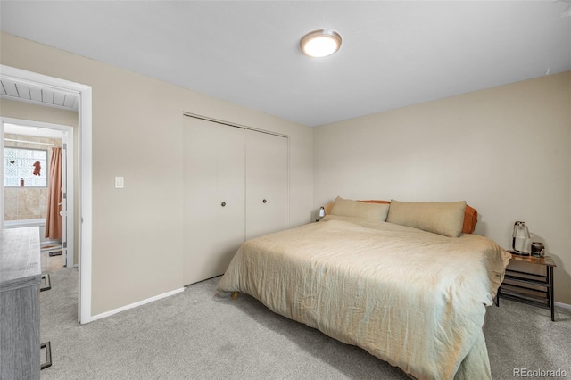 8485 W 44th Ave, Wheat Ridge, CO 80033 - bedroom featuring light colored carpet and a closet