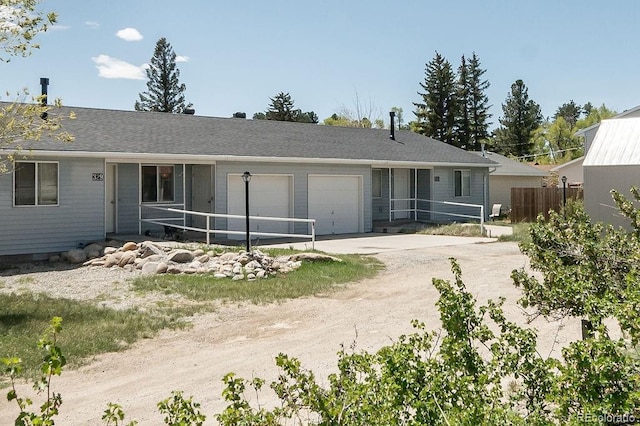 back of house with a garage