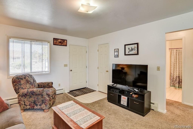 living room with light colored carpet and baseboard heating