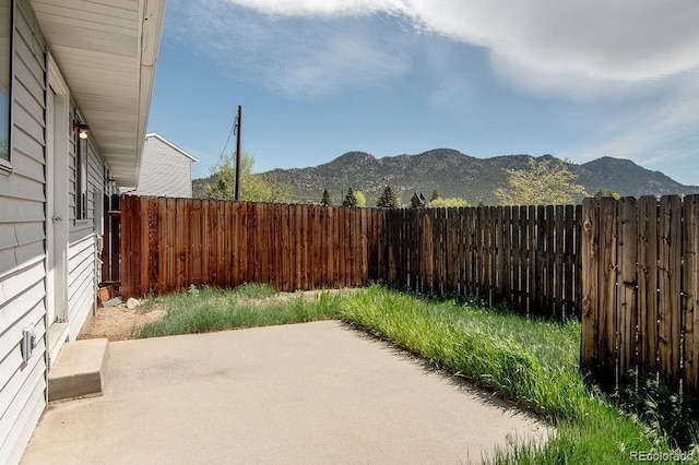 view of patio / terrace featuring a mountain view
