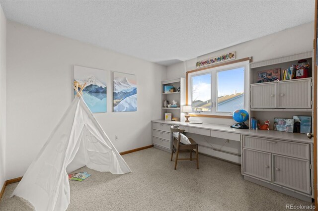 2090 S Gray Dr, Lakewood, CO 80227 - office space featuring baseboards, a textured ceiling, light carpet, and built in desk