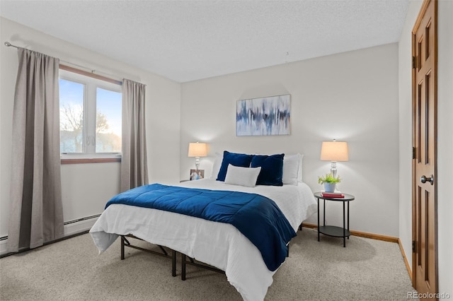 2090 S Gray Dr, Lakewood, CO 80227 - bedroom with baseboard heating, baseboards, carpet floors, and a textured ceiling