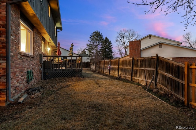 2090 S Gray Dr, Lakewood, CO 80227 - view of yard with a wooden deck and a fenced backyard