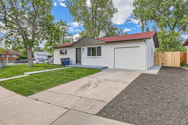 14317 Olmsted Dr, Denver, CO 80239 - ranch-style house featuring an attached garage and driveway