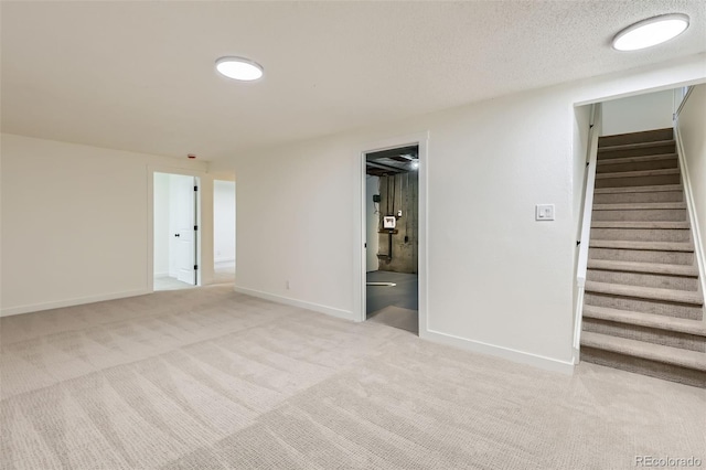 14317 Olmsted Dr, Denver, CO 80239 - carpeted empty room featuring stairs and baseboards