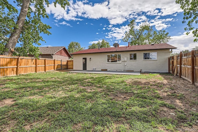 14317 Olmsted Dr, Denver, CO 80239 - back of house with brick siding
