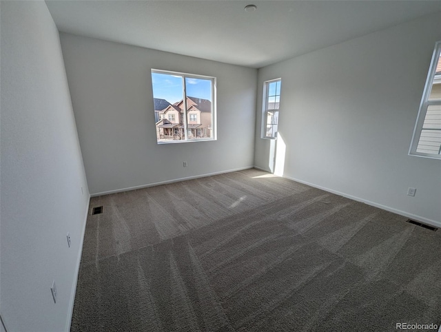 empty room with carpet flooring