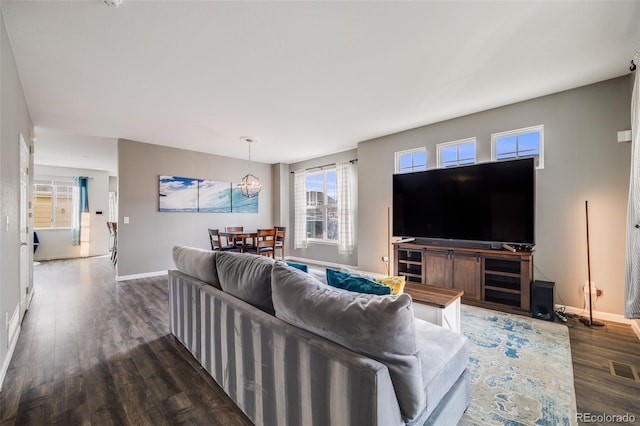 22765 E Ottawa Pl, Aurora, CO 80016 - living room featuring wood finished floors and a chandelier
