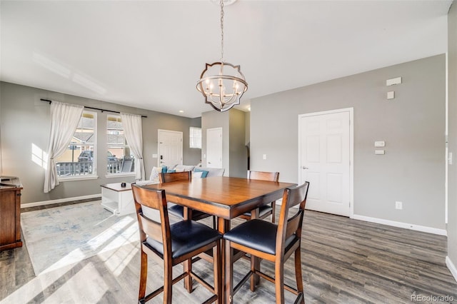 22765 E Ottawa Pl, Aurora, CO 80016 - dining space featuring a chandelier and wood finished floors